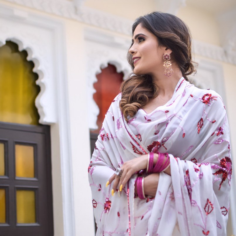 Pretty White Georgette Saree Collection.