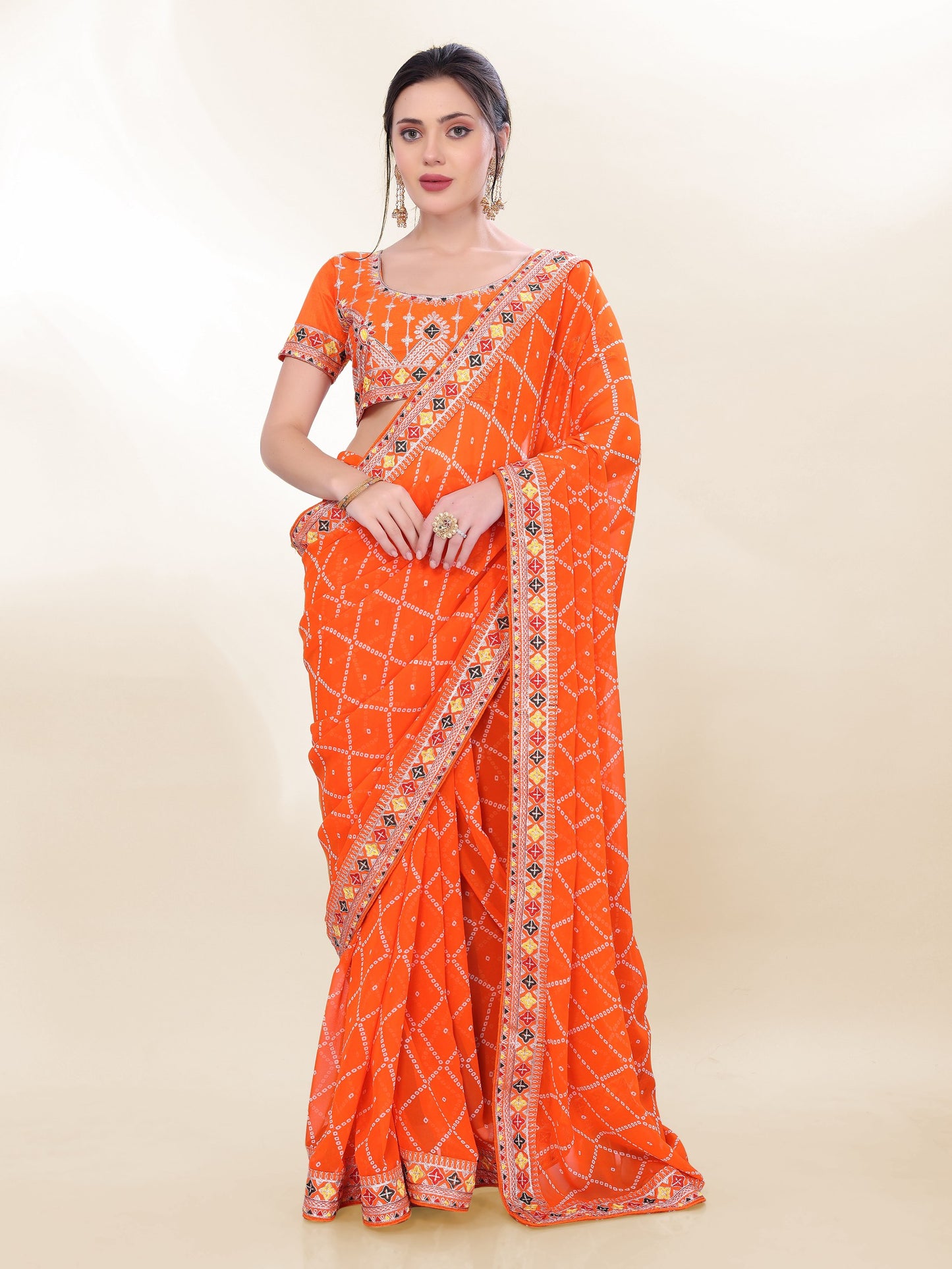 Occasion Wear Special Orange Bandhni Saree Collection.