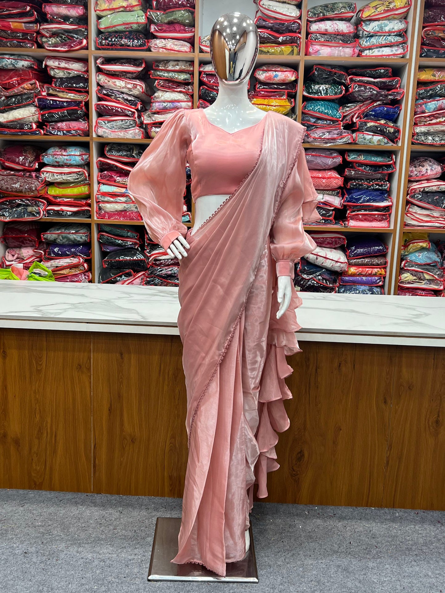 Pretty Peach Colour Party Wear Predrapped Ruffle Ready To Wear Saree Collection.